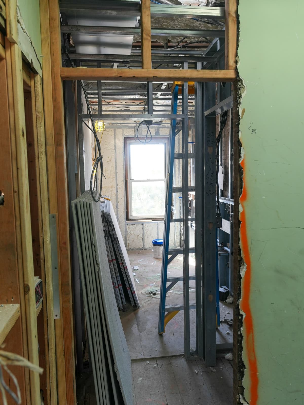 Drywall sheets and framing during an interior renovation